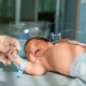 father-holds-hand-newly-born-babe-diapers_11zon (1)