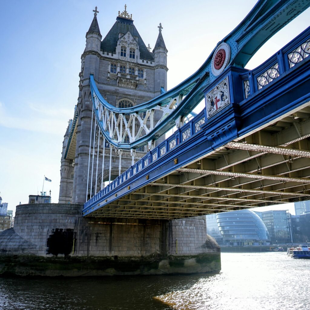 Stunning view of the historic Tower Bridge over River Thames with modern skyline backdrop.