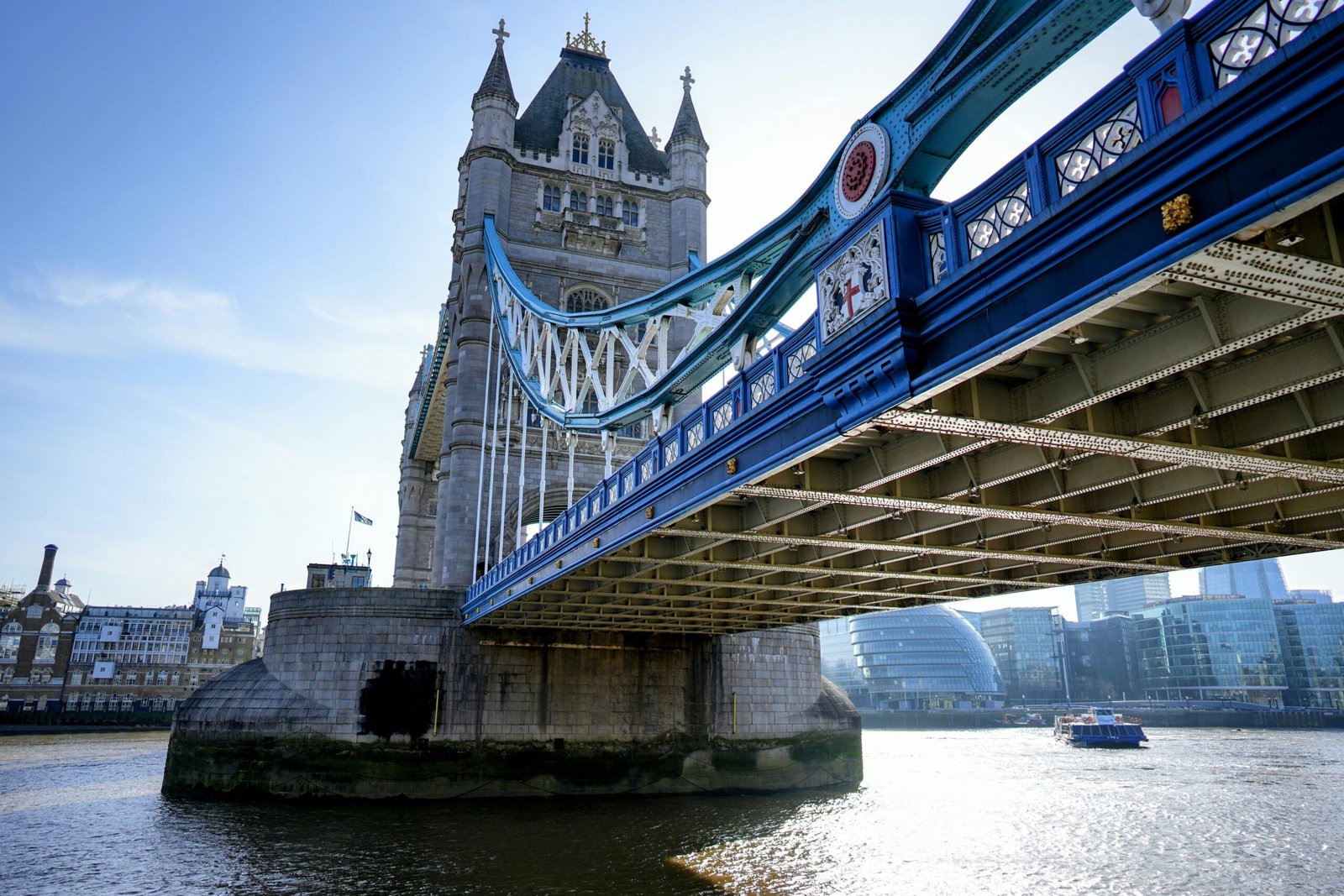 Stunning view of the historic Tower Bridge over River Thames with modern skyline backdrop.