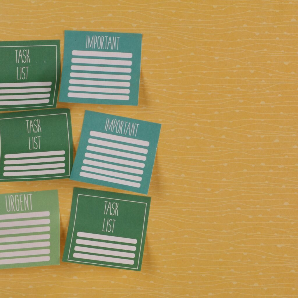 Close-up of colorful sticky notes on yellow background with task-related labels.