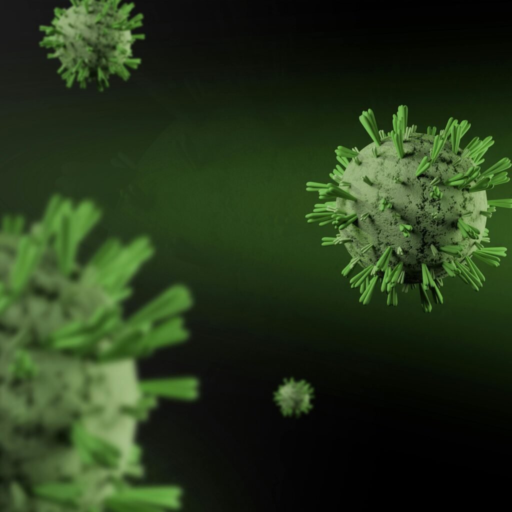 Close-up 3D render of virus particles floating on a dark green background, showcasing detailed virus structure.