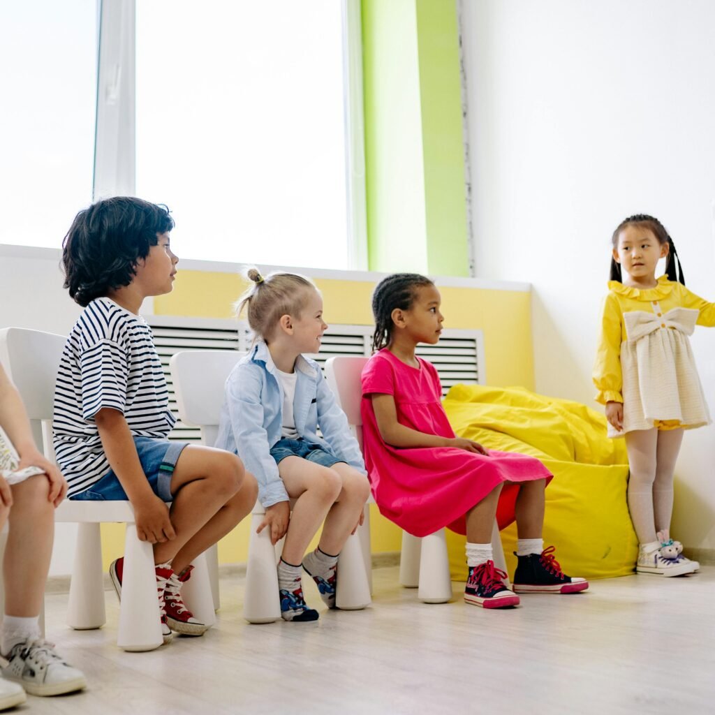 Children engaging in an interactive classroom lesson with colorful visuals, promoting diversity and education.