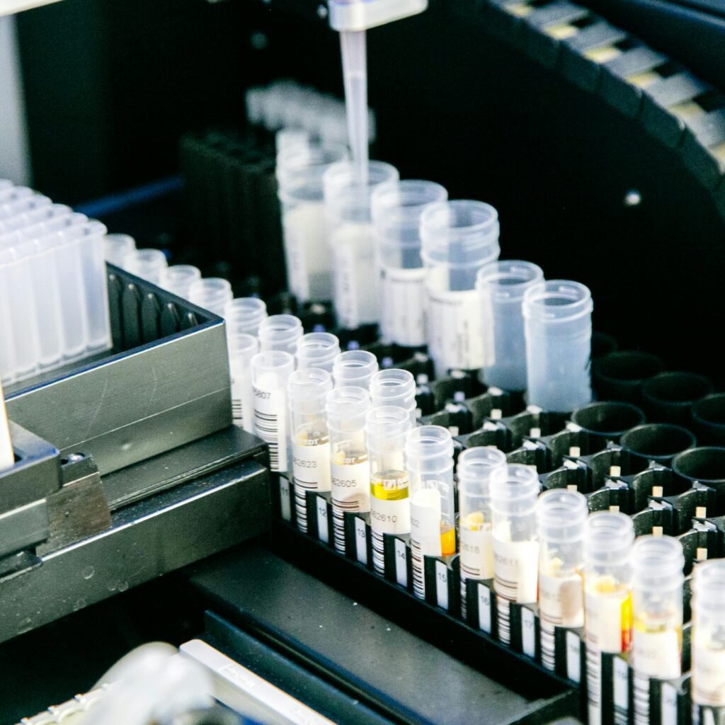 High angle of plastic containers with various samples placed in modern light lab