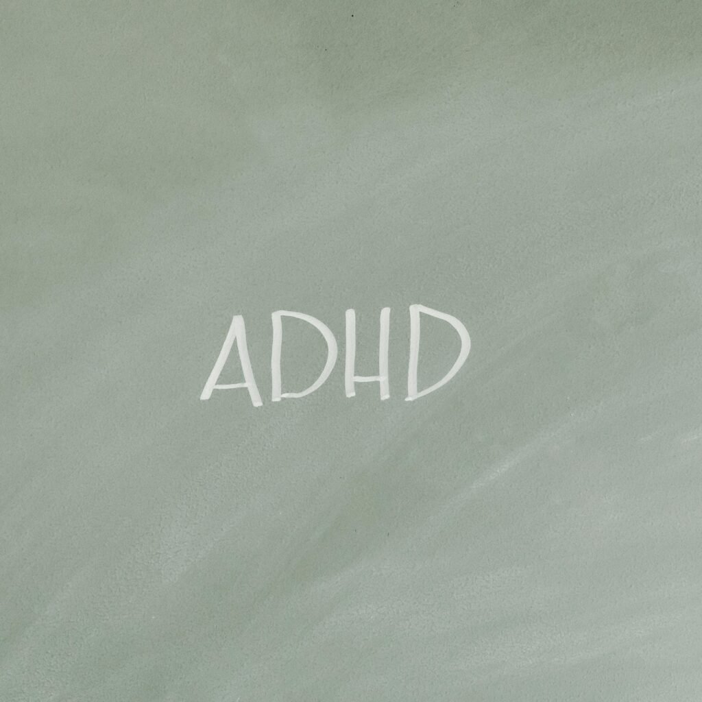 Simple illustration highlighting ADHD awareness with text on a gray background.
