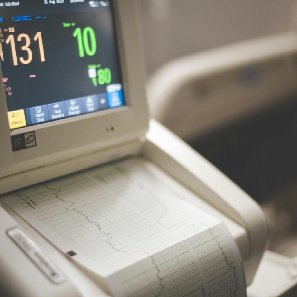 Close-up shot of a medical ECG monitor displaying heart rate and oxygen levels, essential for patient monitoring.