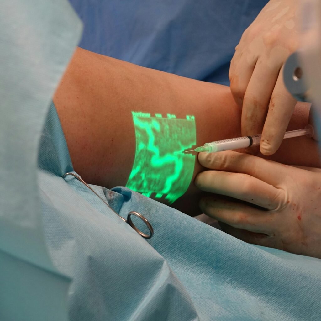 A doctor performs a medical procedure using advanced vein visualization technology.
