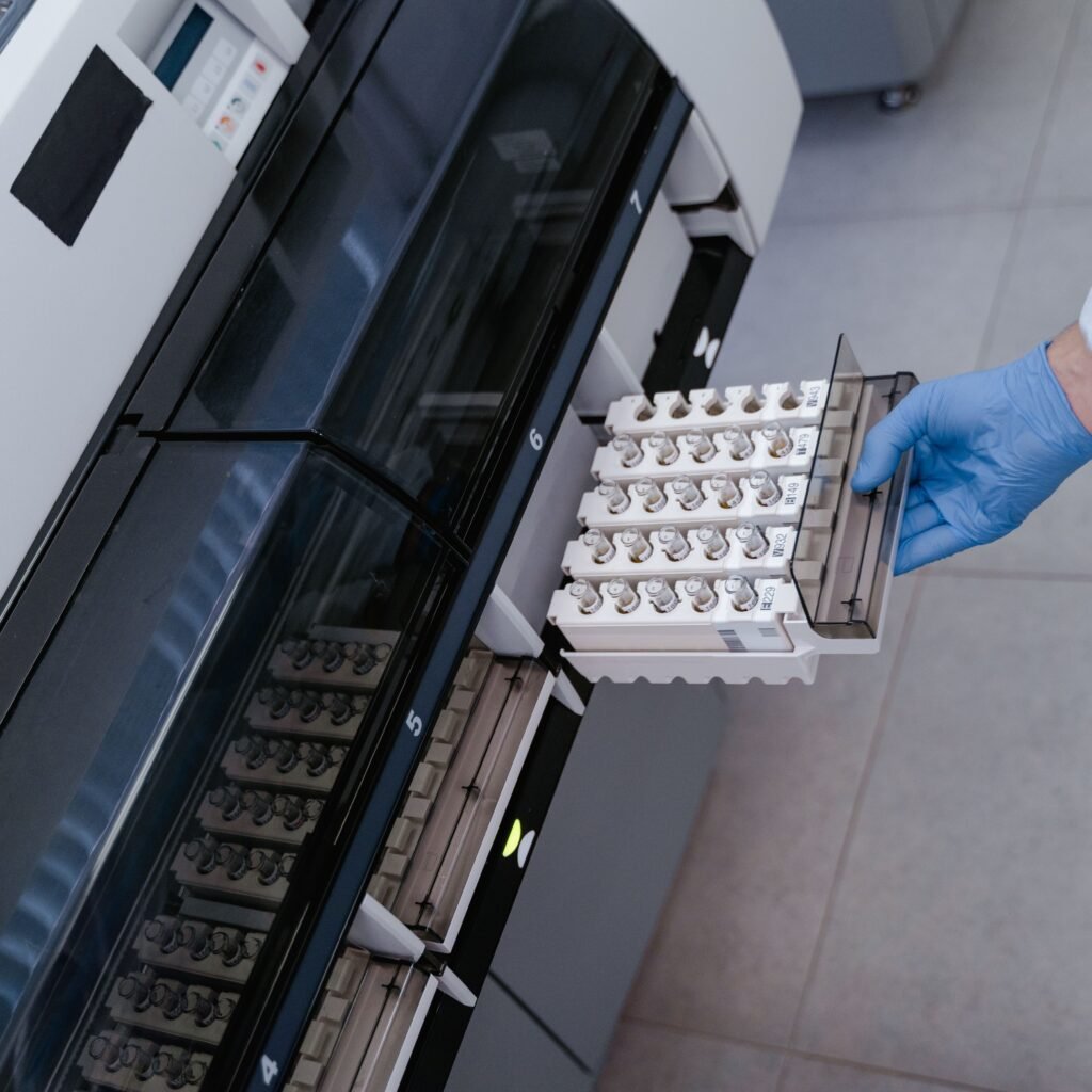 Scientist using advanced lab equipment for research in a modern laboratory setting.