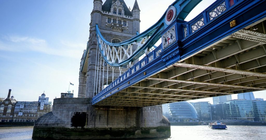 Stunning view of the historic Tower Bridge over River Thames with modern skyline backdrop.