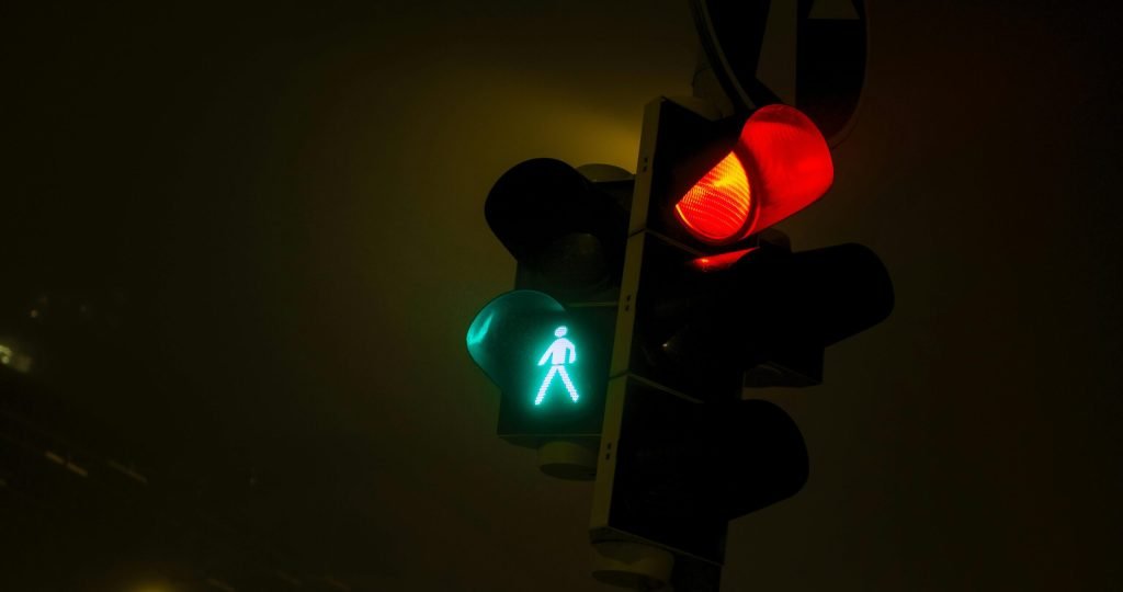 Red and green traffic lights at night in Bratislava, Slovensko.