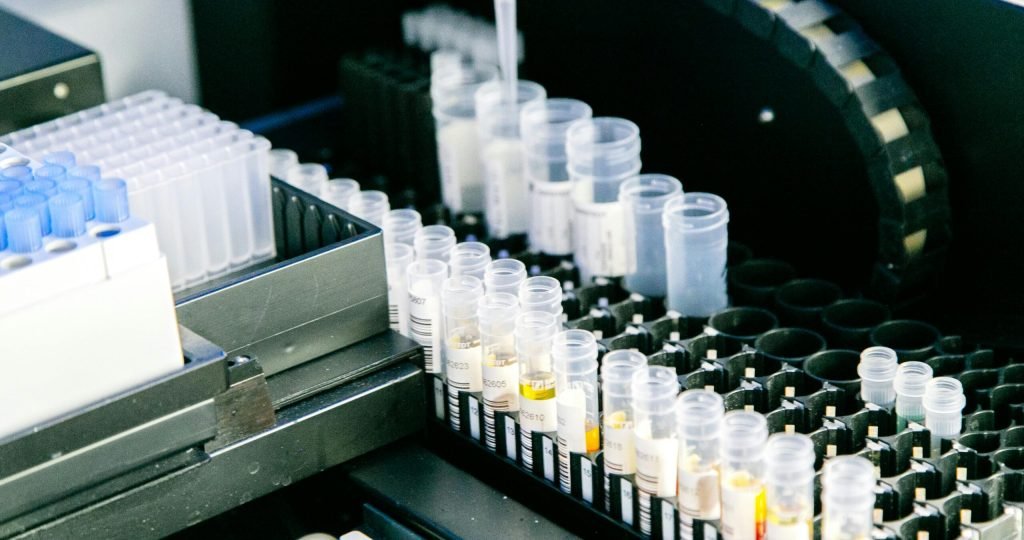 High angle of plastic containers with various samples placed in modern light lab
