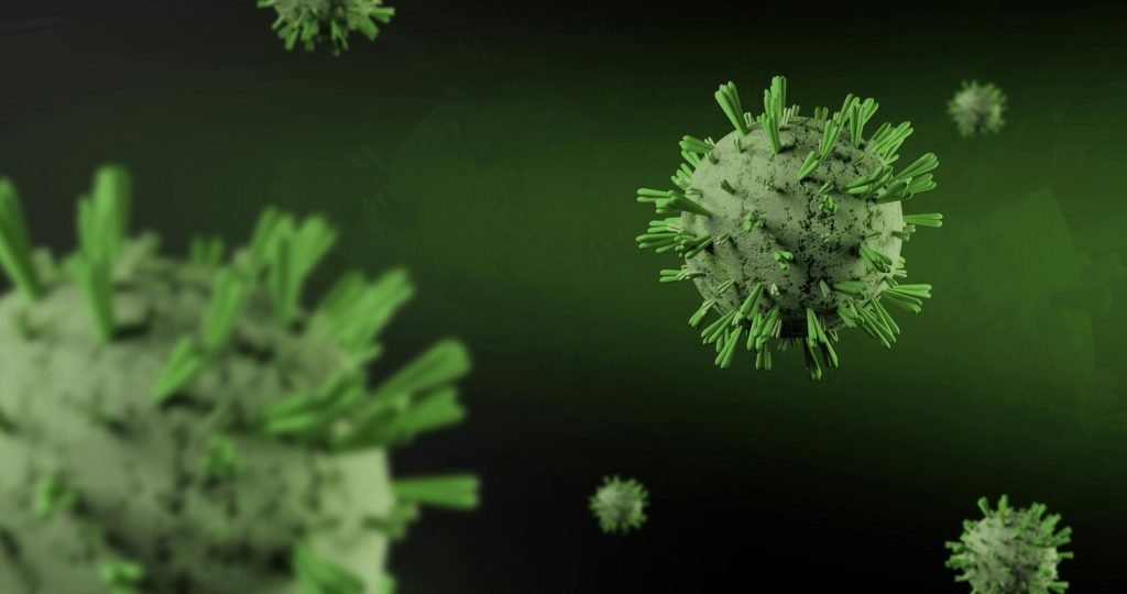 Close-up 3D render of virus particles floating on a dark green background, showcasing detailed virus structure.