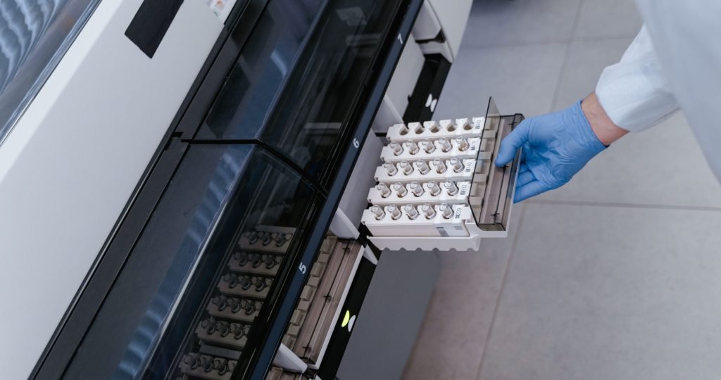 Scientist using advanced lab equipment for research in a modern laboratory setting.